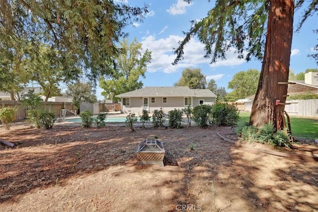 exterior space with a fenced in pool