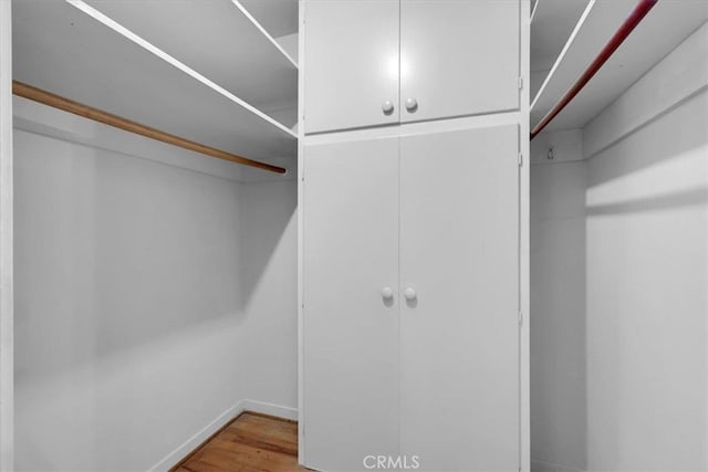 walk in closet featuring light wood-type flooring