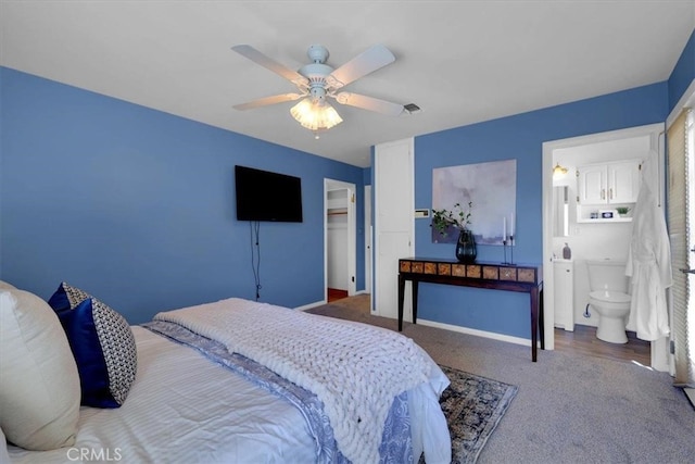 carpeted bedroom with ceiling fan, a closet, and connected bathroom