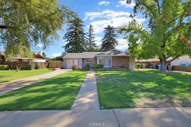 single story home with a garage and a front yard