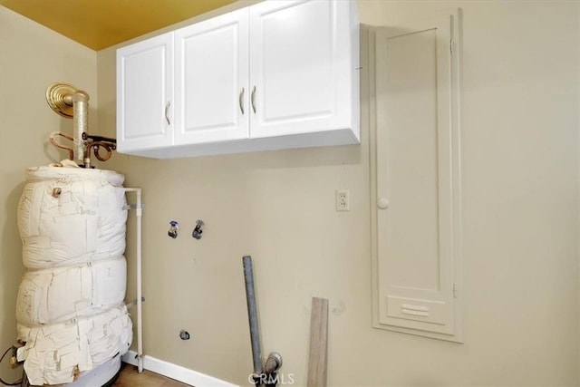 laundry room featuring cabinets