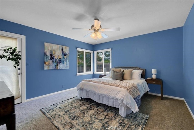 bedroom featuring dark colored carpet and ceiling fan