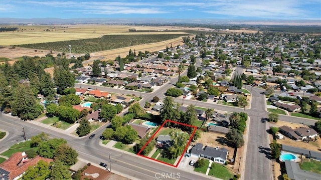 birds eye view of property with a rural view