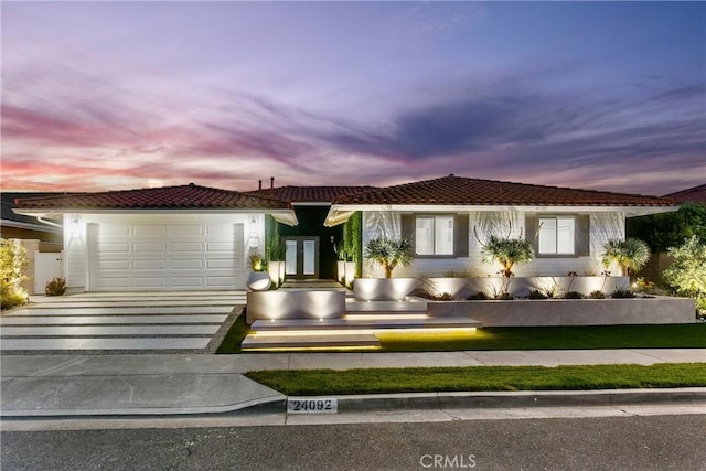 view of front of home with a garage