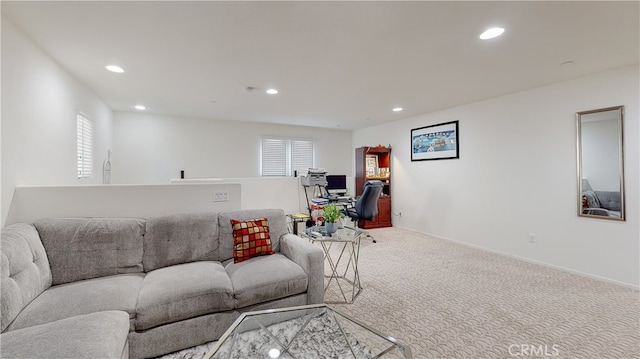 living room featuring light carpet and plenty of natural light