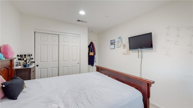 carpeted bedroom with a closet