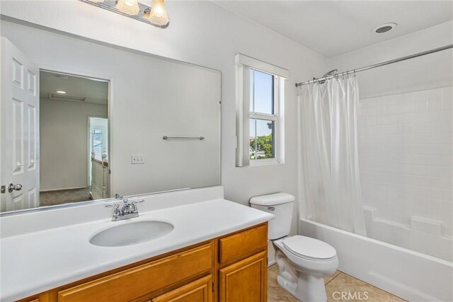 35375 Trevino Trl, Beaumont, CA 92223 - bathroom with toilet, vanity, shower / bath combo with shower curtain, and tile patterned floors