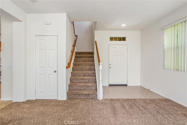 view of carpeted foyer