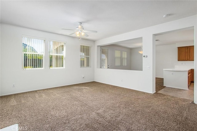 carpeted empty room with ceiling fan