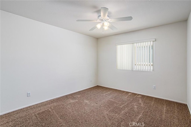 empty room featuring carpet and ceiling fan