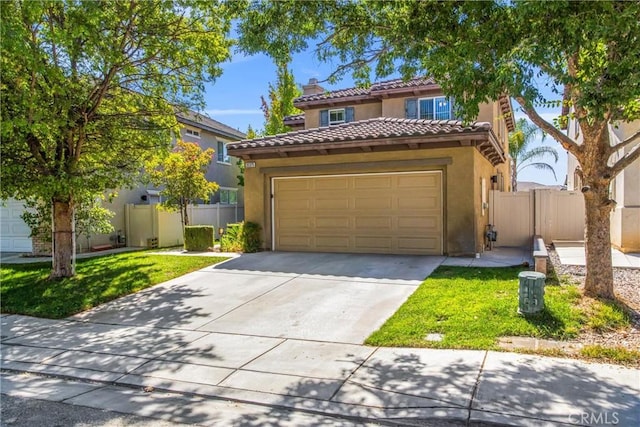 mediterranean / spanish-style home with a front lawn and a garage