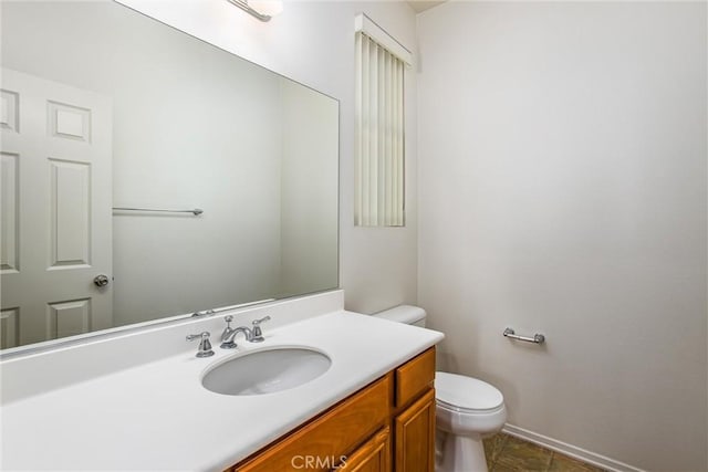 35375 Trevino Trl, Beaumont, CA 92223 - bathroom with toilet, vanity, baseboards, and tile patterned flooring