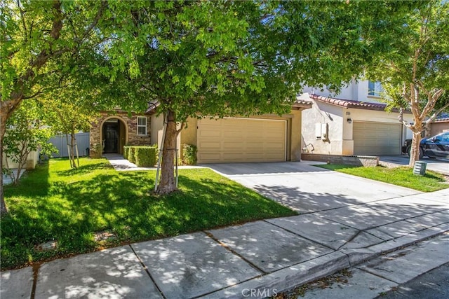 35375 Trevino Trl, Beaumont, CA 92223 - view of property hidden behind natural elements with concrete driveway, stucco siding, a front yard, a tiled roof, and an attached garage