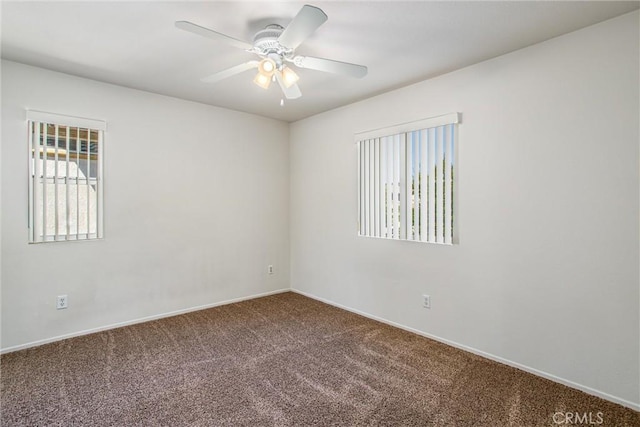 carpeted empty room featuring ceiling fan