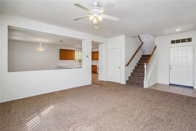 35375 Trevino Trl, Beaumont, CA 92223 - unfurnished living room with carpet, stairs, ceiling fan, baseboards, and recessed lighting