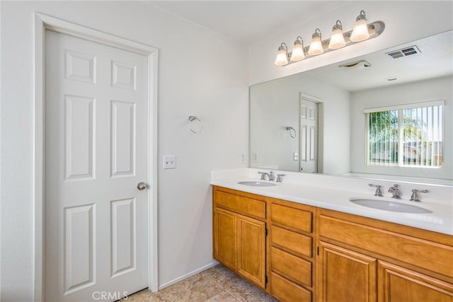 bathroom featuring tile patterned floors and vanity