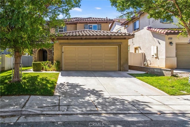 35375 Trevino Trl, Beaumont, CA 92223 - view of front of house with driveway, stucco siding, a tiled roof, and an attached garage