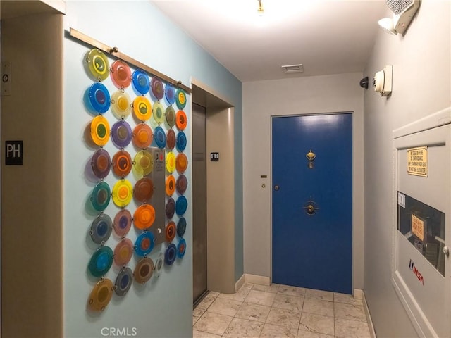 doorway to outside with elevator