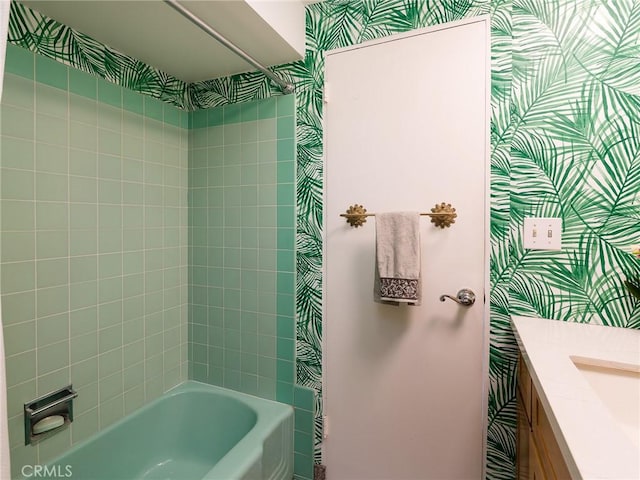 bathroom with vanity and tiled shower / bath combo