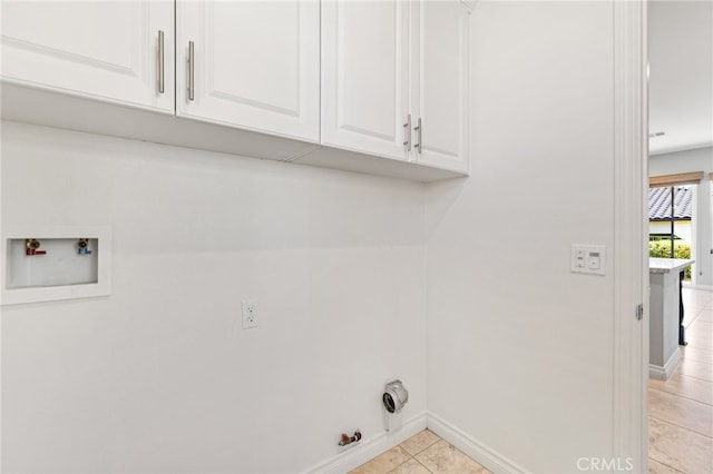 laundry room with cabinets, washer hookup, light tile patterned flooring, and gas dryer hookup