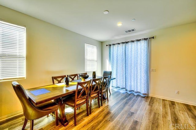 dining space featuring hardwood / wood-style floors