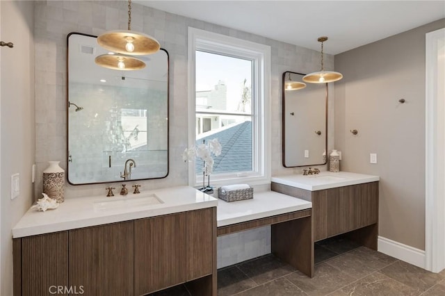 bathroom with vanity and a shower