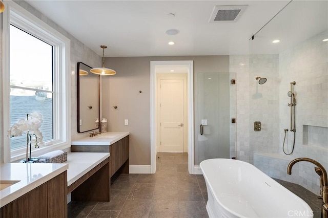 bathroom featuring vanity and separate shower and tub