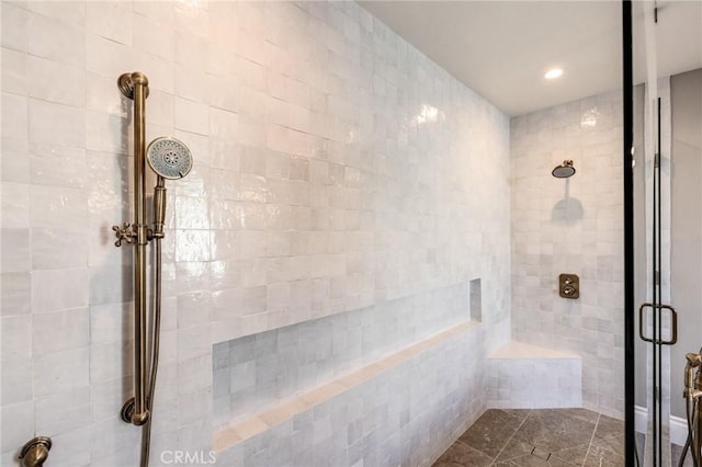 bathroom with tile patterned floors and a shower with shower door