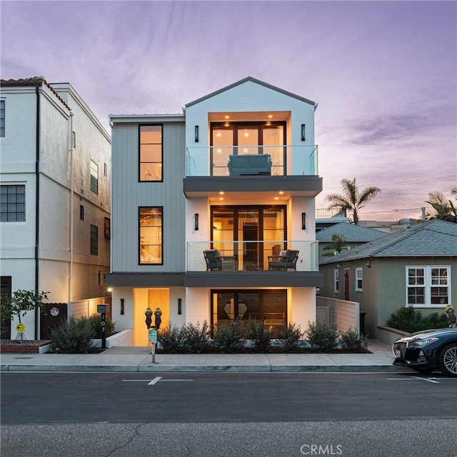 contemporary home with a balcony