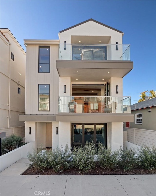 rear view of house with a balcony