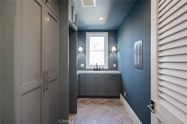 bathroom with vanity and decorative backsplash