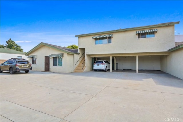 view of front of house with a carport