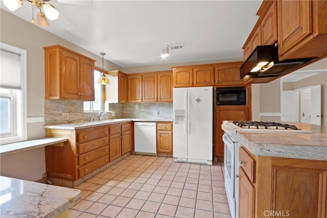 kitchen with decorative backsplash, white appliances, ventilation hood, ceiling fan, and pendant lighting