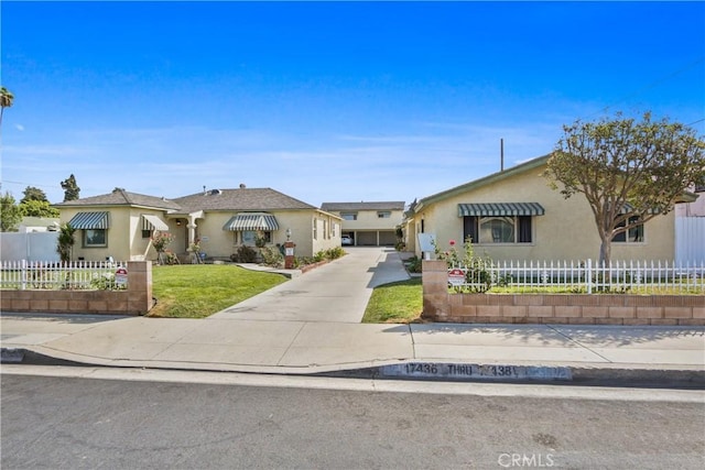 ranch-style home featuring a front yard