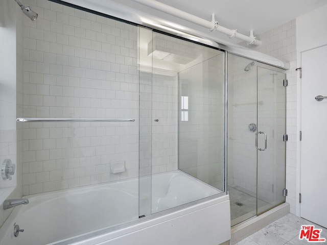 bathroom featuring enclosed tub / shower combo