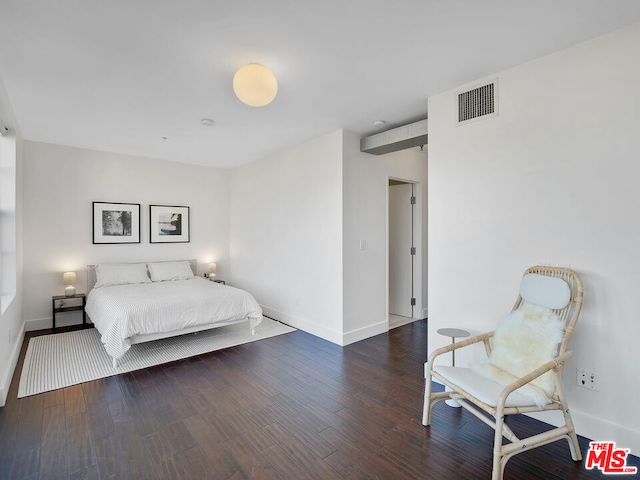 bedroom featuring dark wood-type flooring