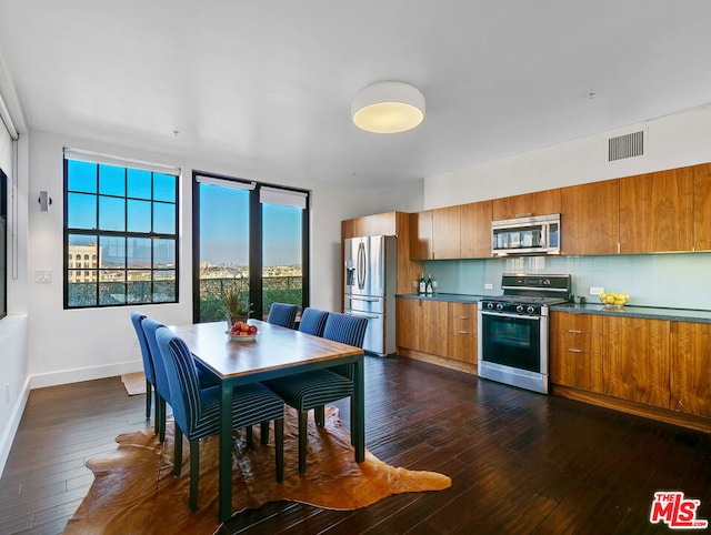 dining space featuring dark wood-type flooring