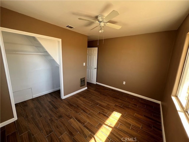 unfurnished bedroom featuring ceiling fan