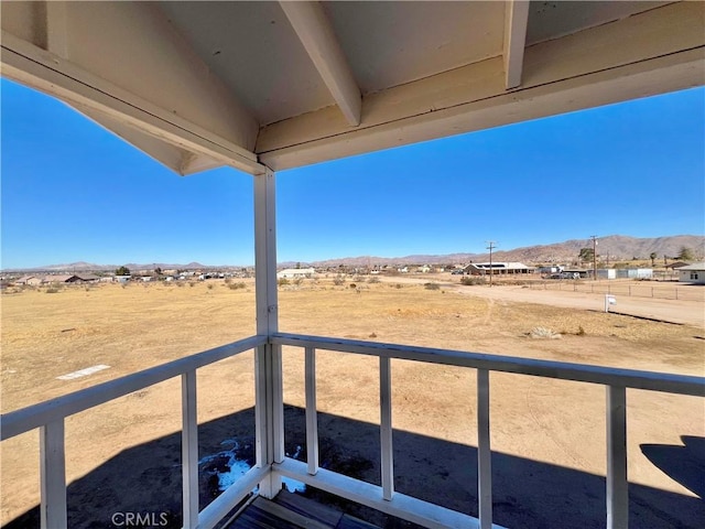 balcony with a mountain view and a rural view