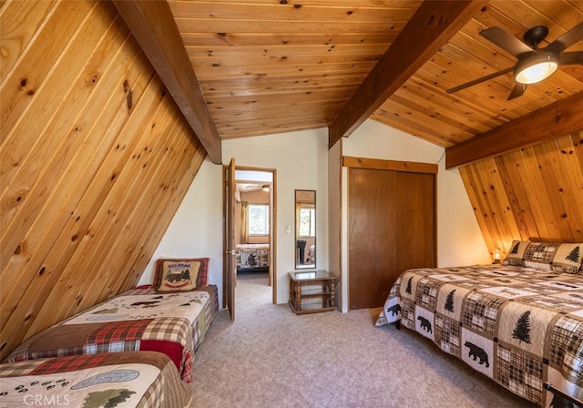 carpeted bedroom featuring lofted ceiling with beams, wood walls, a closet, wooden ceiling, and ceiling fan