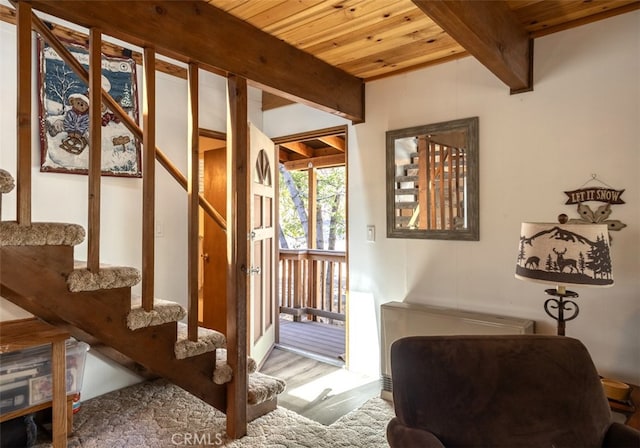 interior space featuring wood ceiling and beamed ceiling