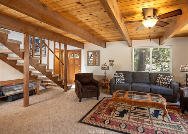 carpeted living room with wood ceiling, beam ceiling, and ceiling fan