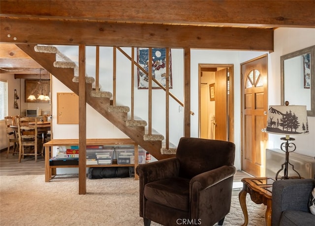 living room featuring wood-type flooring and beam ceiling