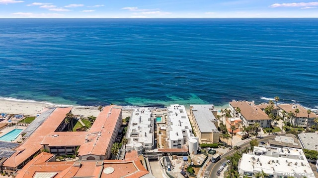 drone / aerial view with a view of the beach and a water view