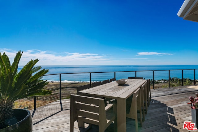 wooden deck with a water view