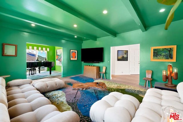 living room with wood-type flooring and beam ceiling