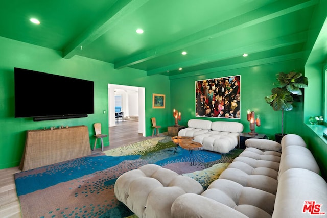 living room featuring wood-type flooring and beamed ceiling