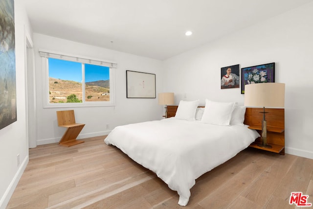 bedroom featuring light wood-type flooring