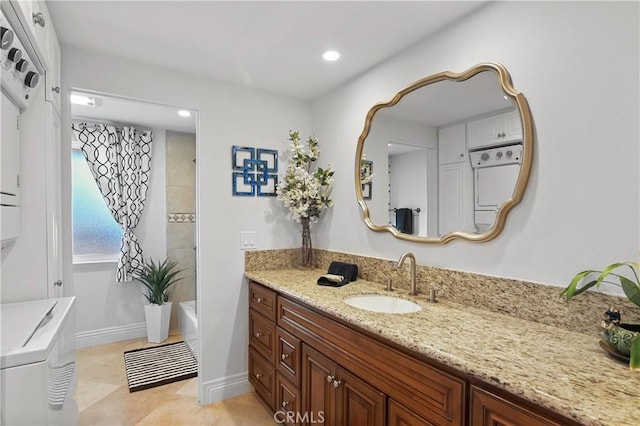 bathroom featuring recessed lighting, baseboards, and vanity