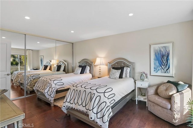 bedroom featuring recessed lighting, a closet, and hardwood / wood-style flooring